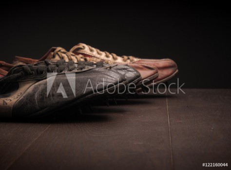 Bild på Grandpas sport shoes on wood